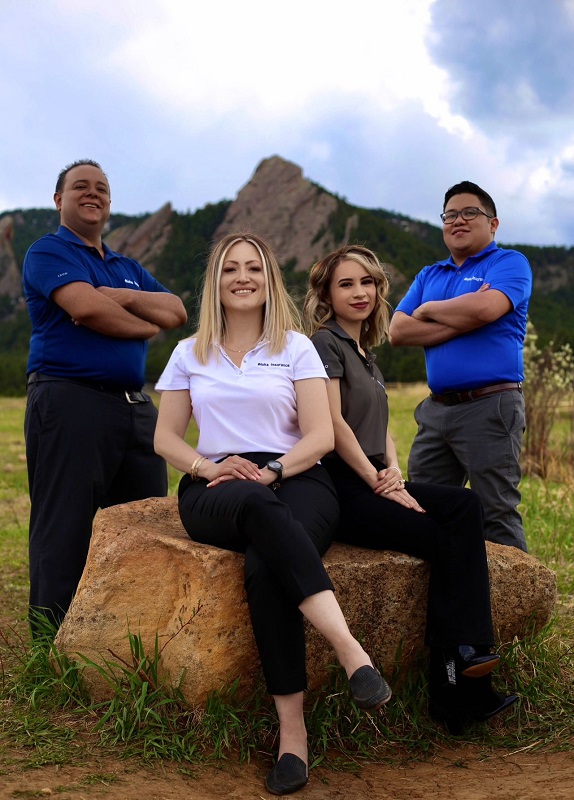 a group of people sitting posing for the camera