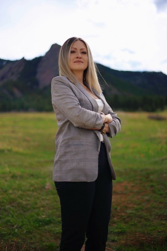 a woman standing in a field